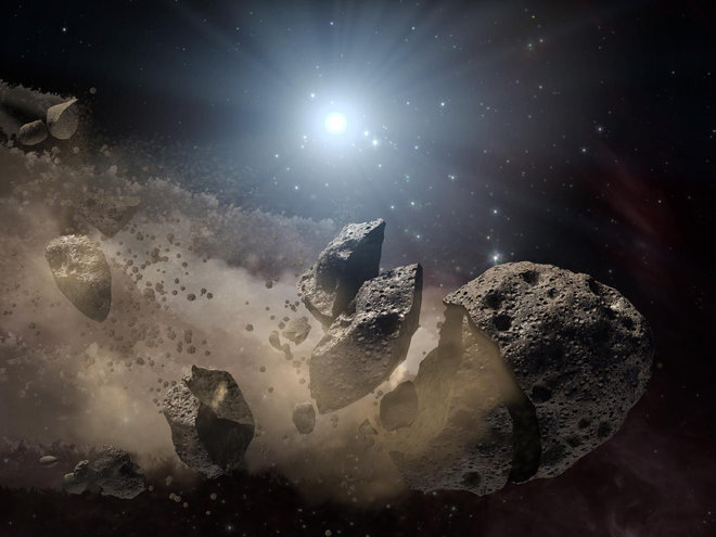 Artist impression van een asteroïde die uit elkaar valt.